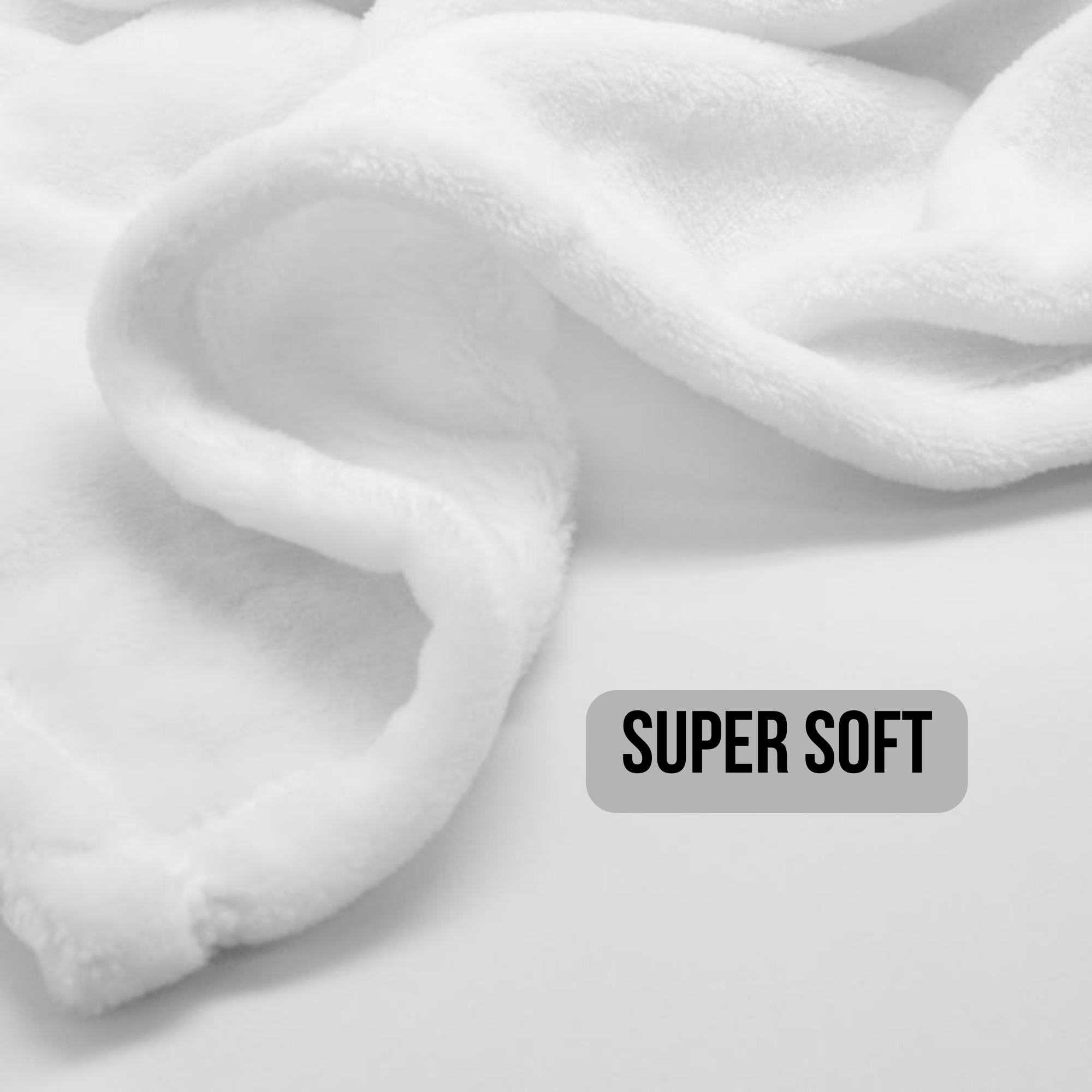 Close-up of  the corner super soft white fabric with 'SUPER SOFT' label.