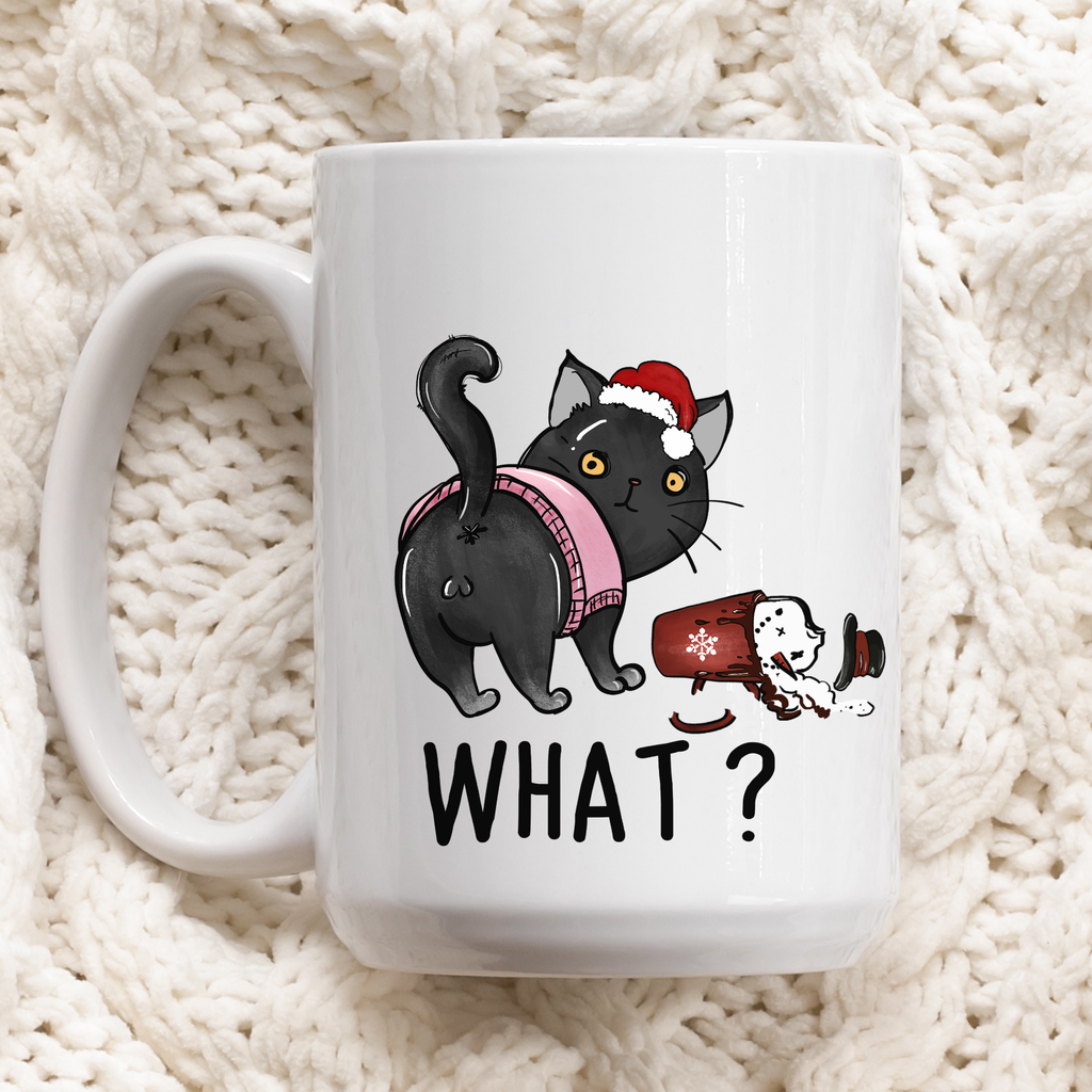 White mug with a black cat Christmas illustration and 'WHAT?' text on a textured white background
