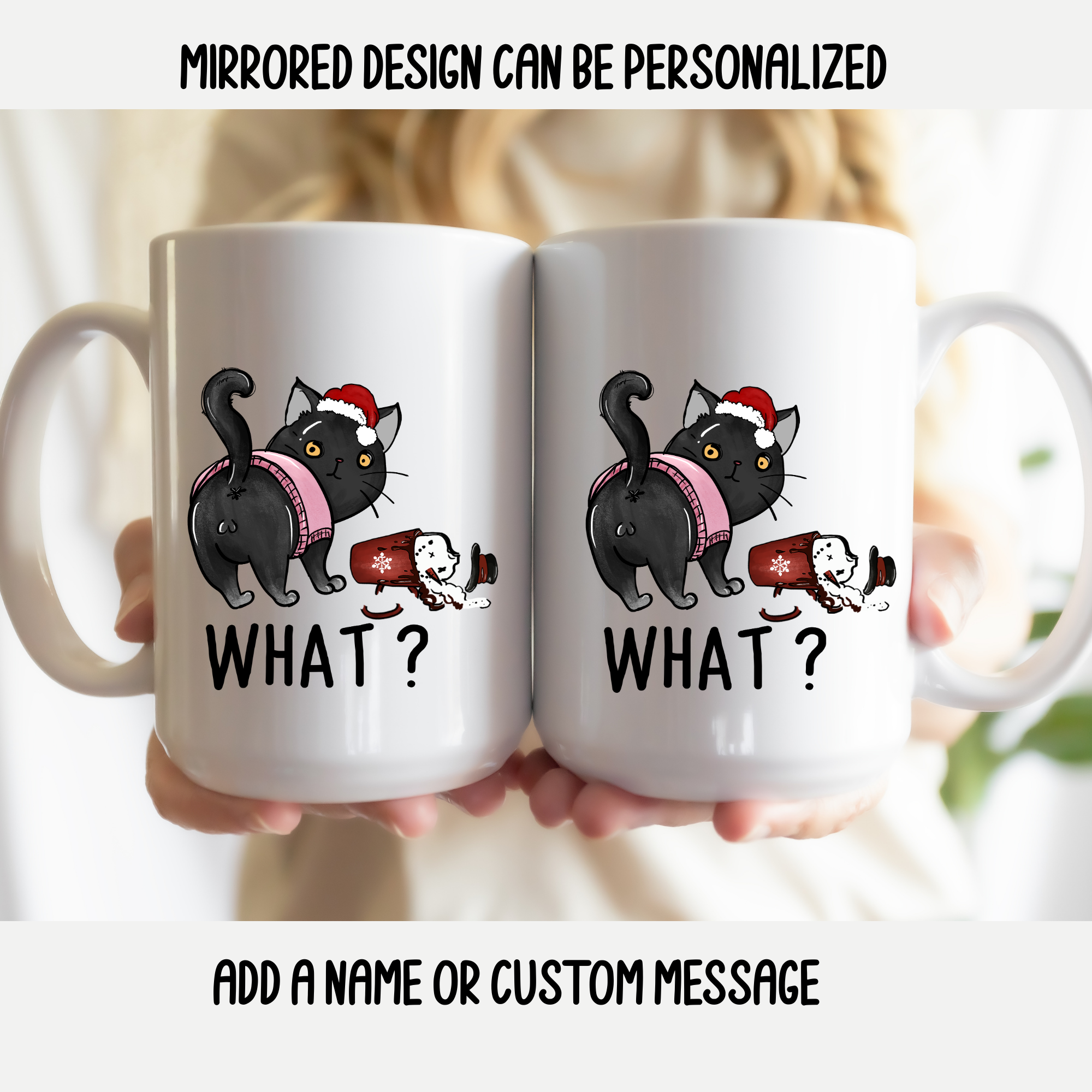 Two white mugs with  featuring a mirrored design of a black cat wearing a Santa hat and the text 'WHAT?' on a blurred background.
