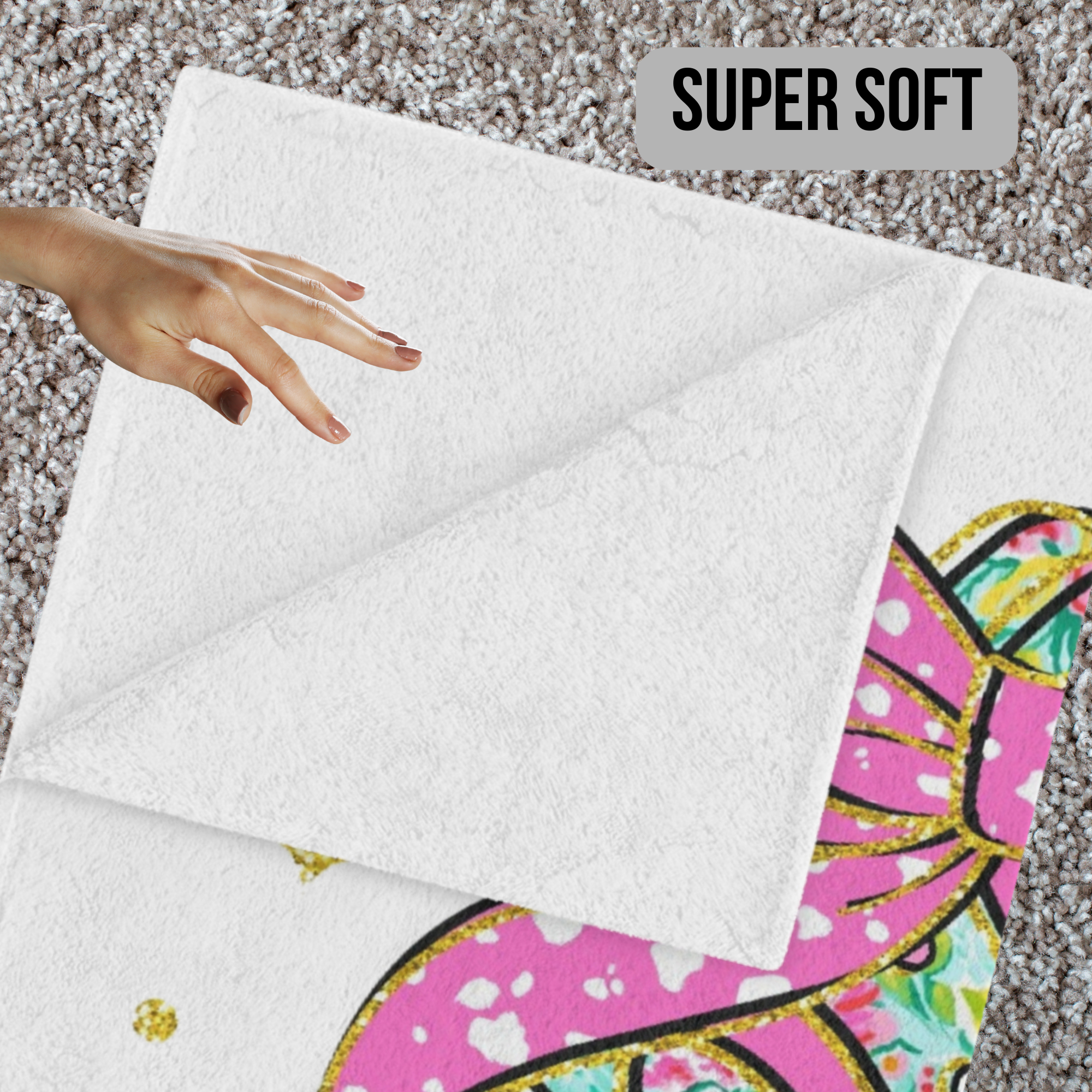 White minky blanket with colorful Christmas Tree Cake design on a textured surface, labeled 'Super Soft'.