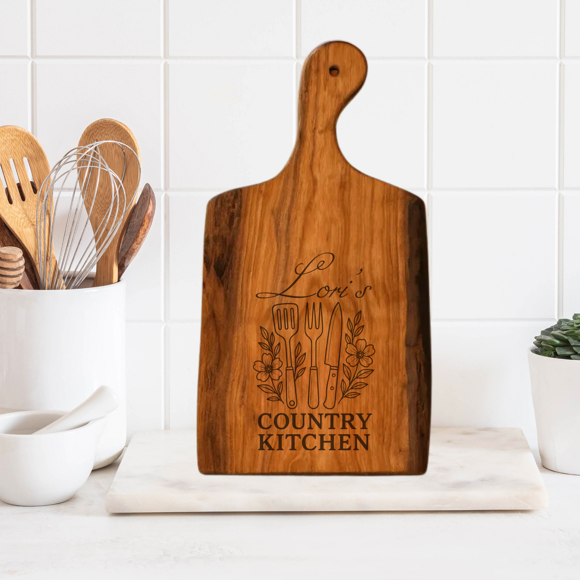 Wooden cutting board with engraved text on a kitchen counter