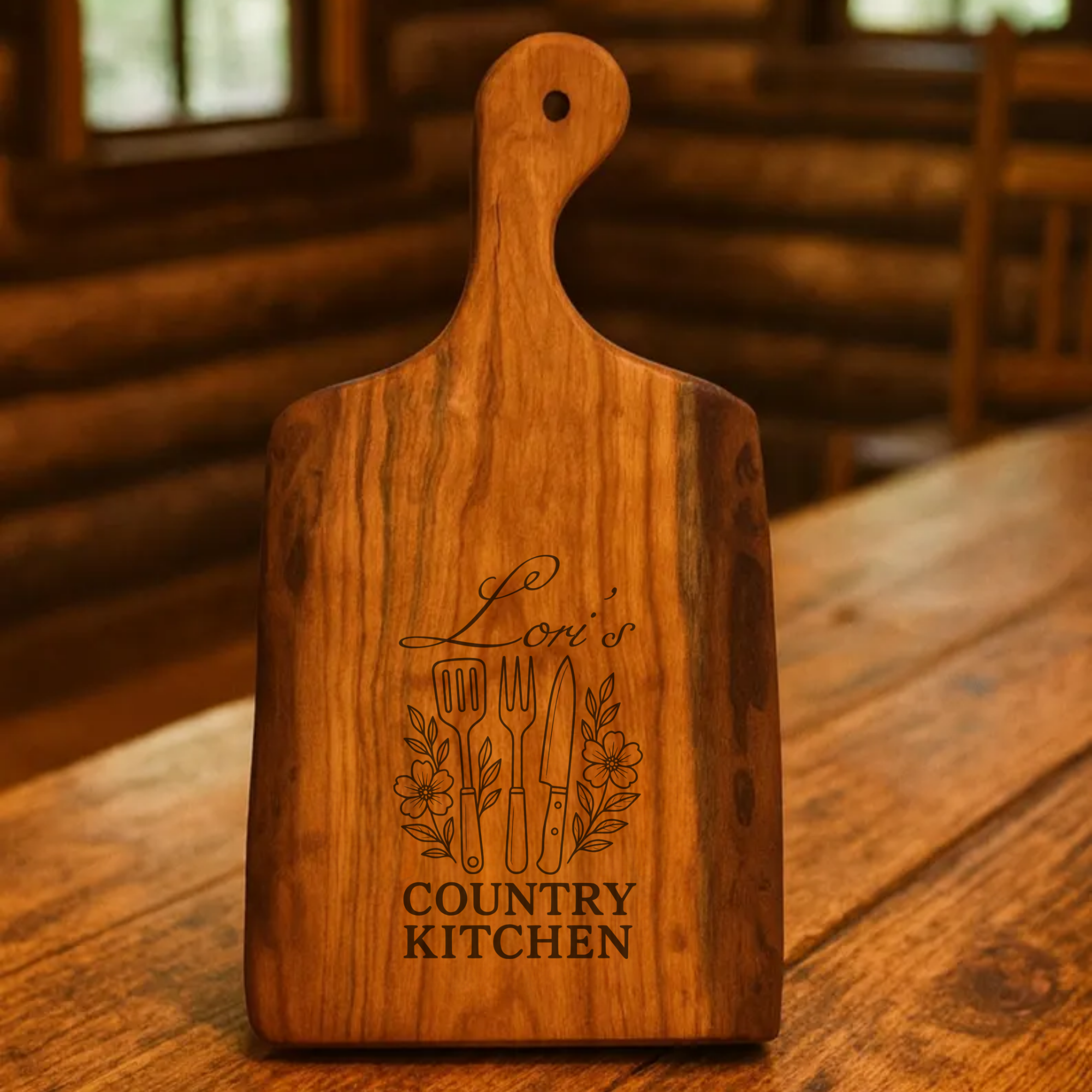 Wooden cutting board with 'Lori's Country Kitchen' engraving on a wooden surface.