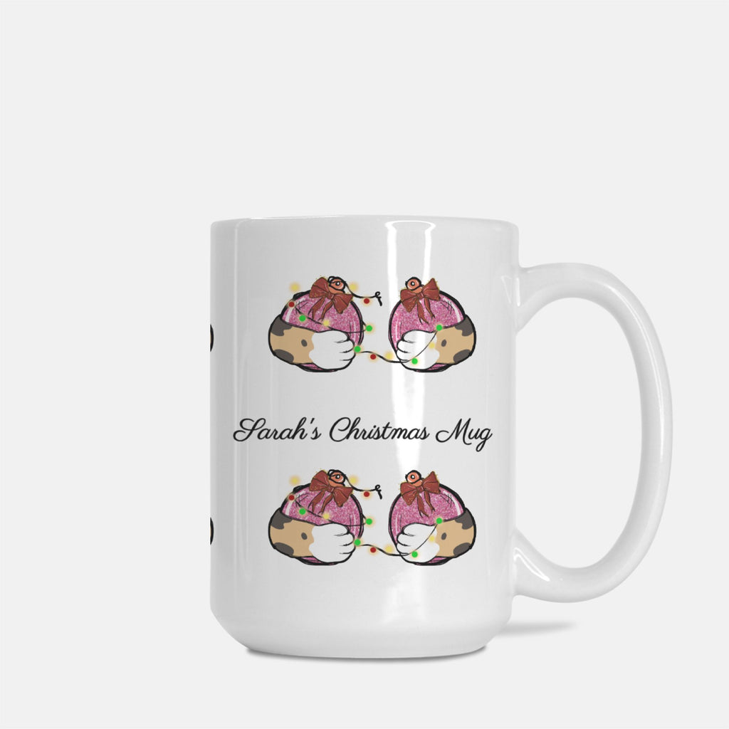 White mug with cartoon penguins design and 'Sarah's Christmas Mug' text on a white background
