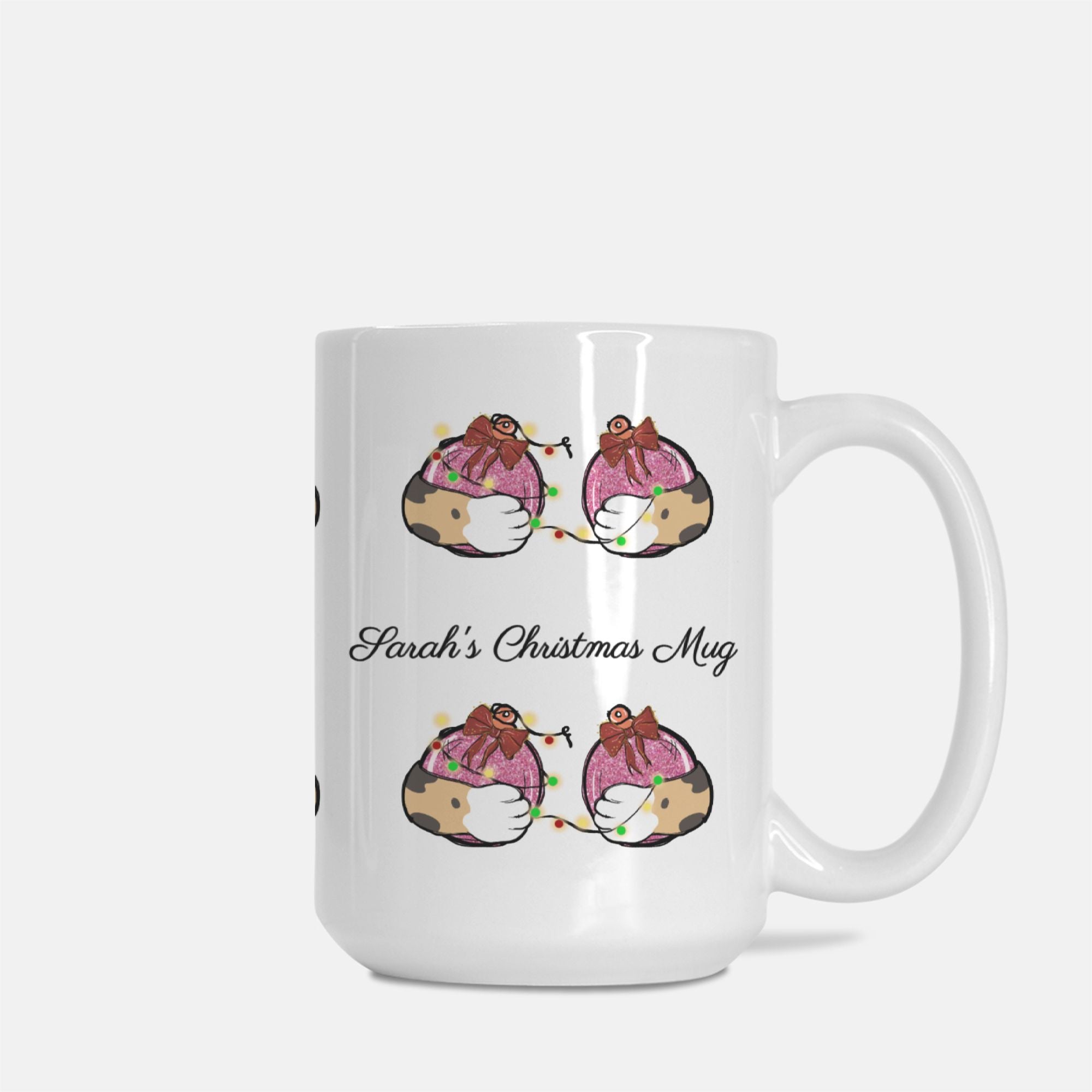 White mug with cartoon penguins design and 'Sarah's Christmas Mug' text on a white background