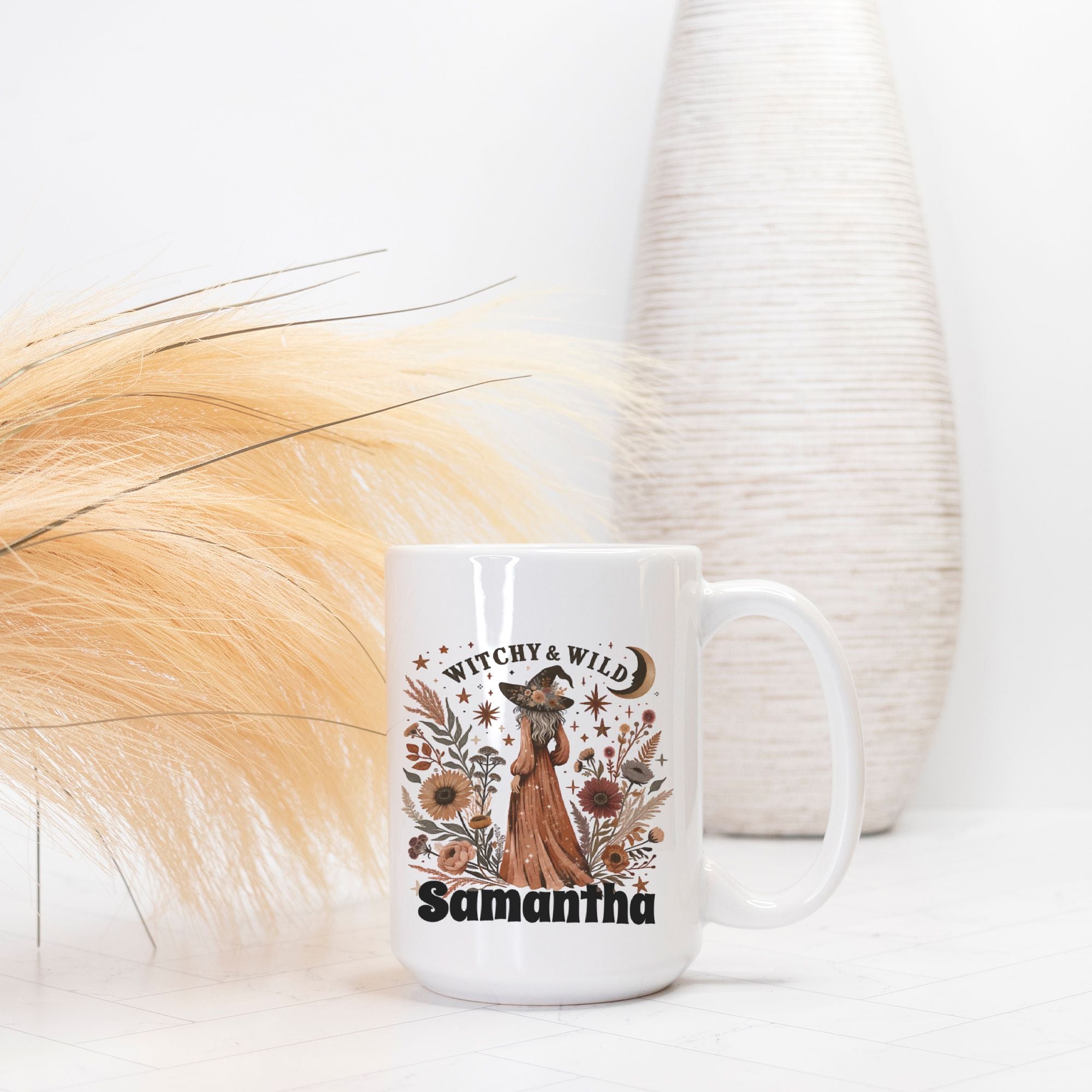 White mug with a witch-themed design and text 'Witchy & Wild Samantha' on a white background.