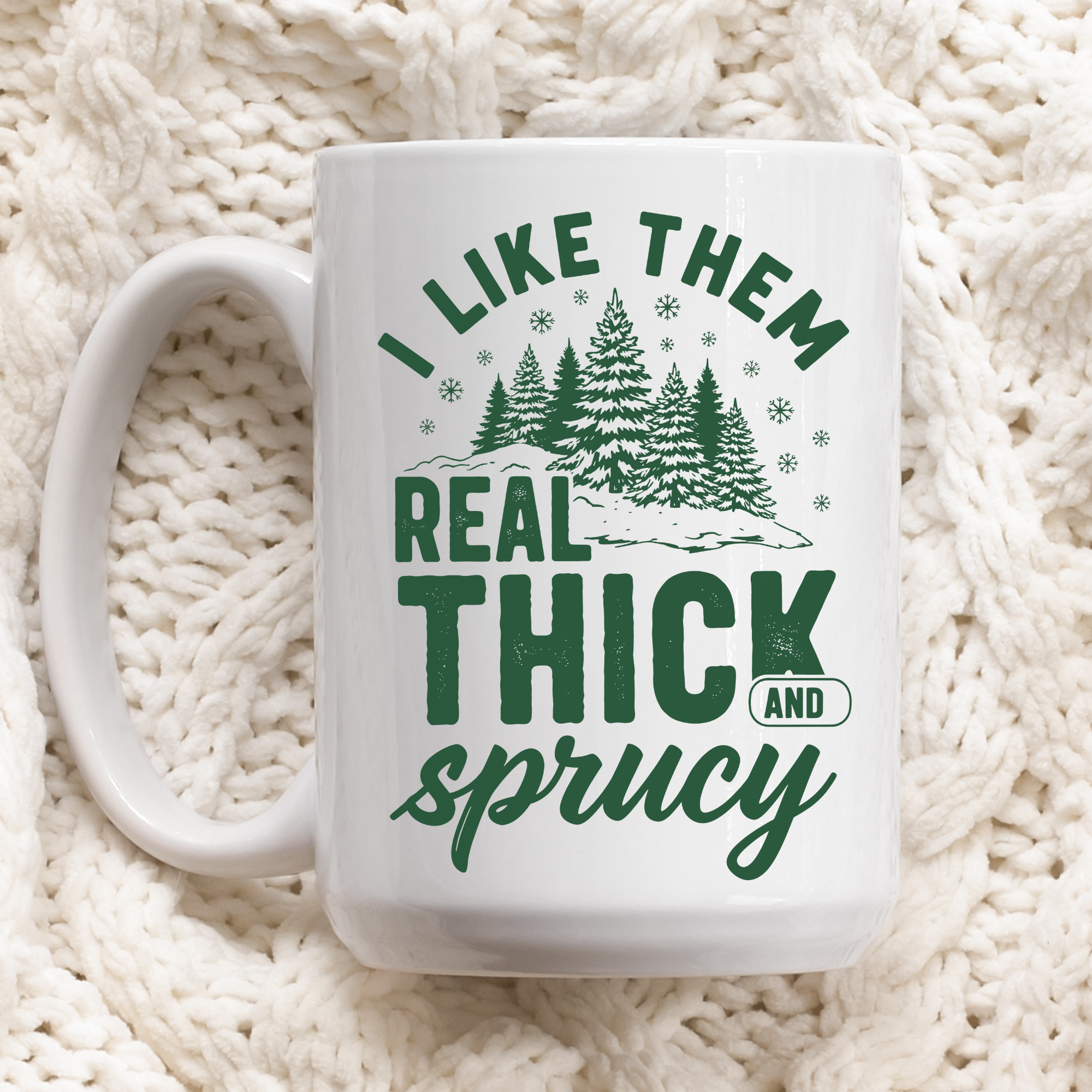 White mug with green text and forest design on a white textured background