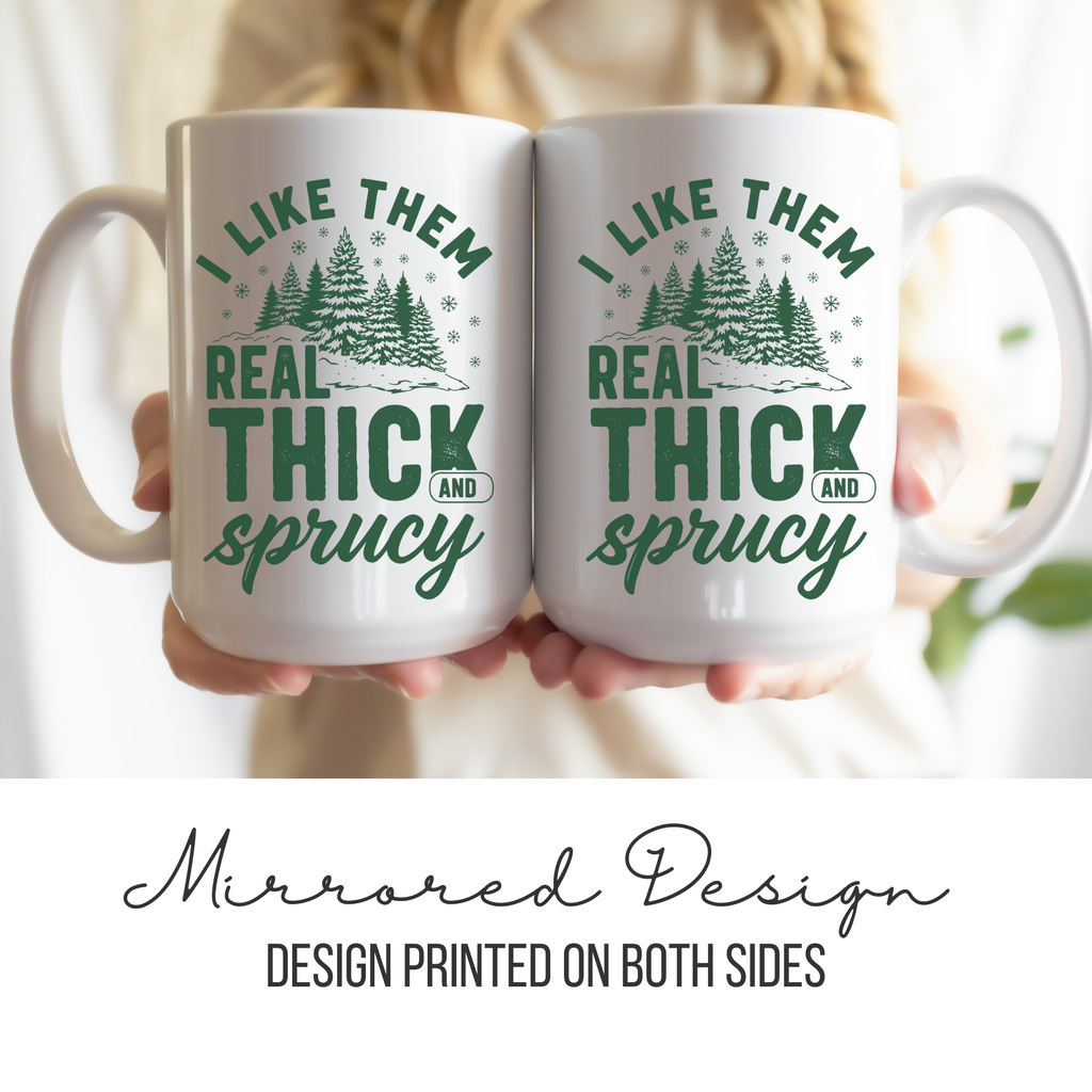 Two white mugs with mirrored green and white design held by a person.