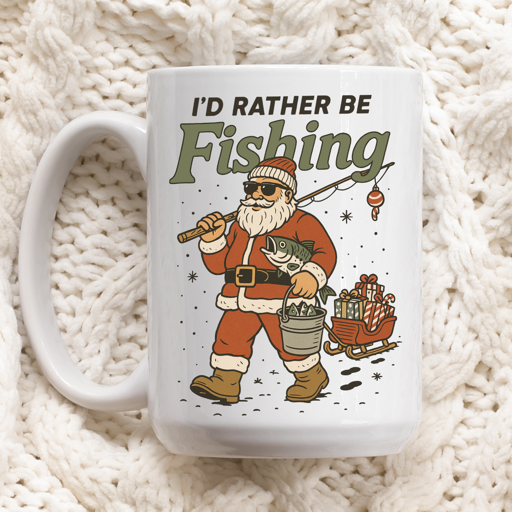 Mug with Santa Claus illustration and 'I'd Rather Be Fishing' text on a textured white background