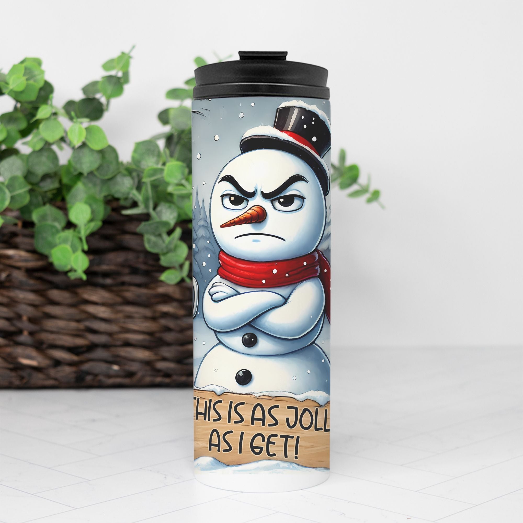 Tumbler with a snowman design and text on a white background