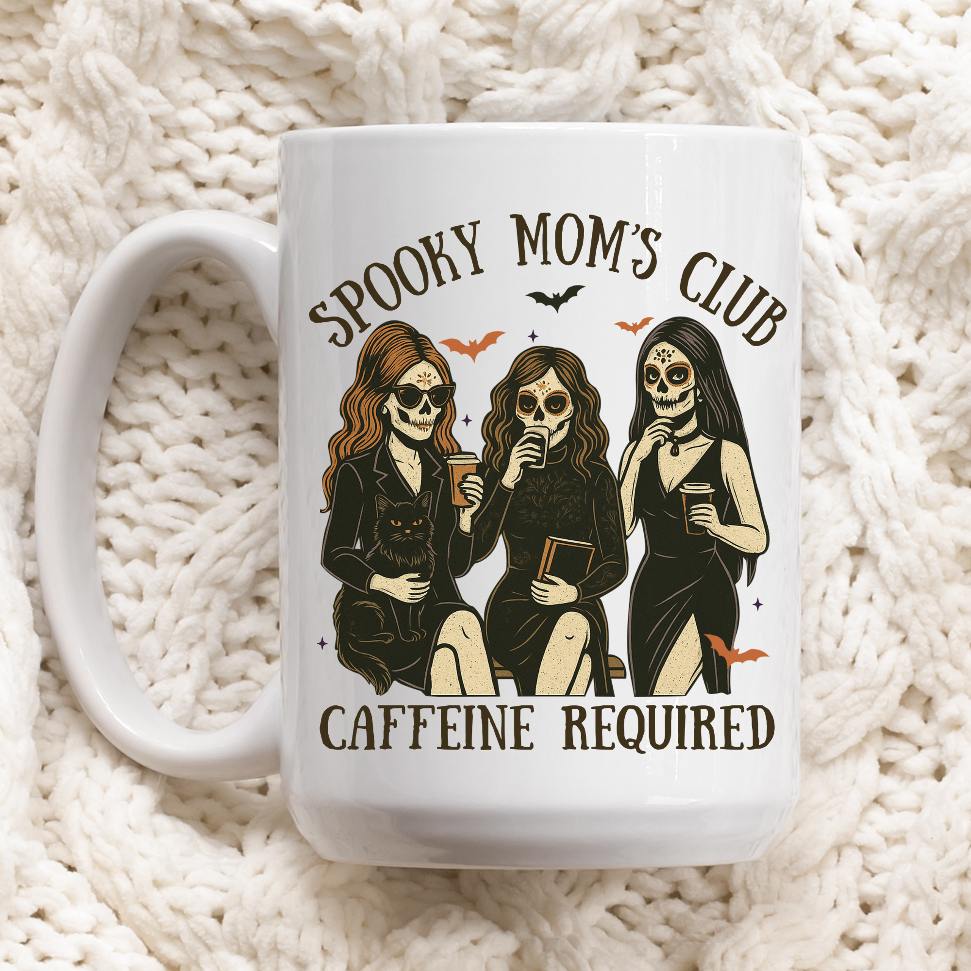 Mug with 'Spooky Mom's Club Caffeine Required' design on a textured white background