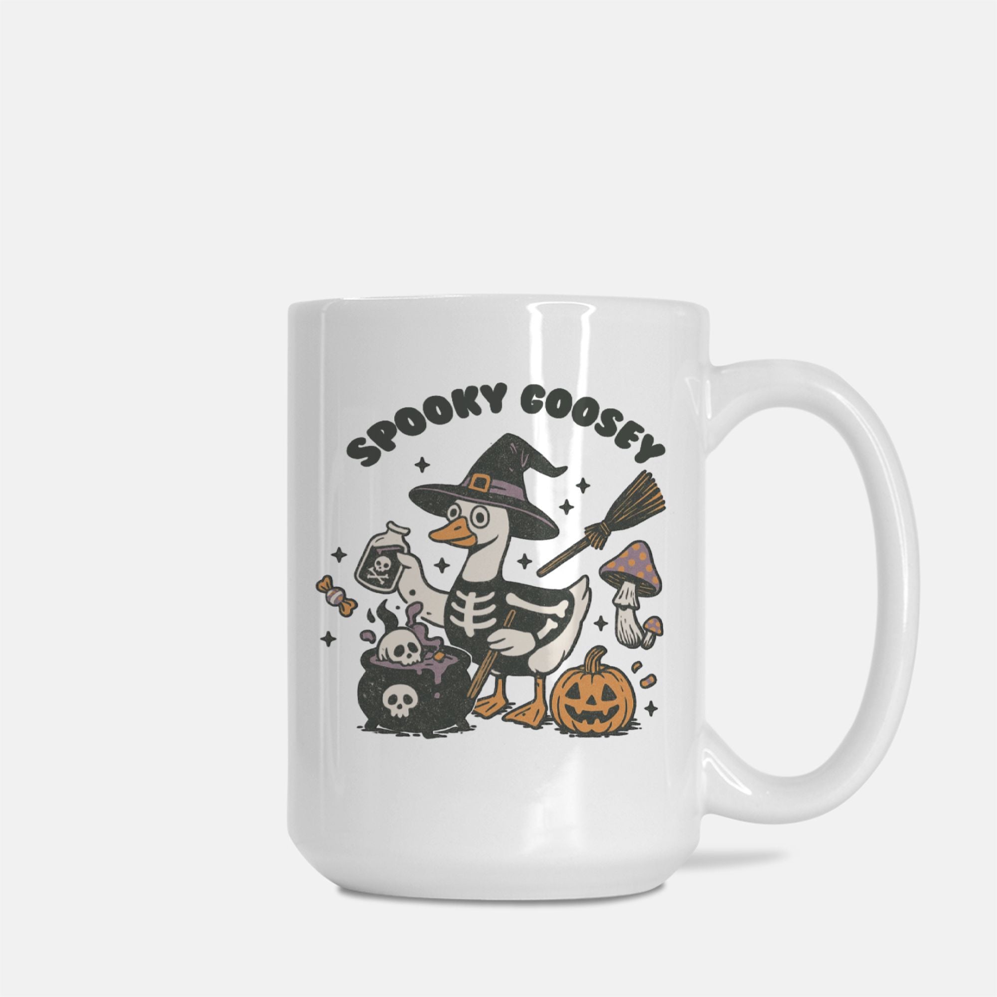 White mug with Halloween-themed design featuring a skeleton goose, witch hat, broom, and pumpkin on a white background.