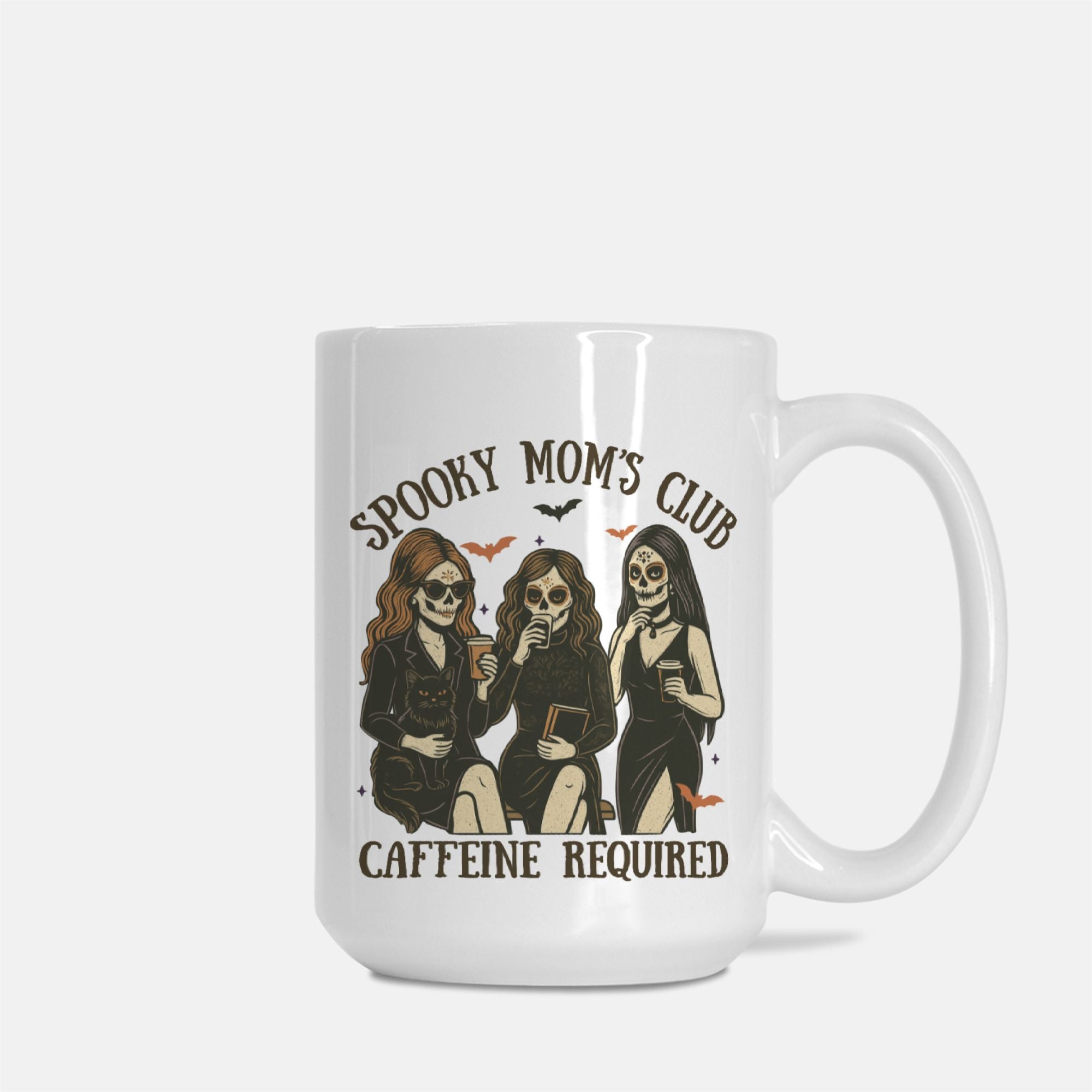 White mug with 'Spooky Mom's Club Caffeine Required' design featuring skeletons on a white background