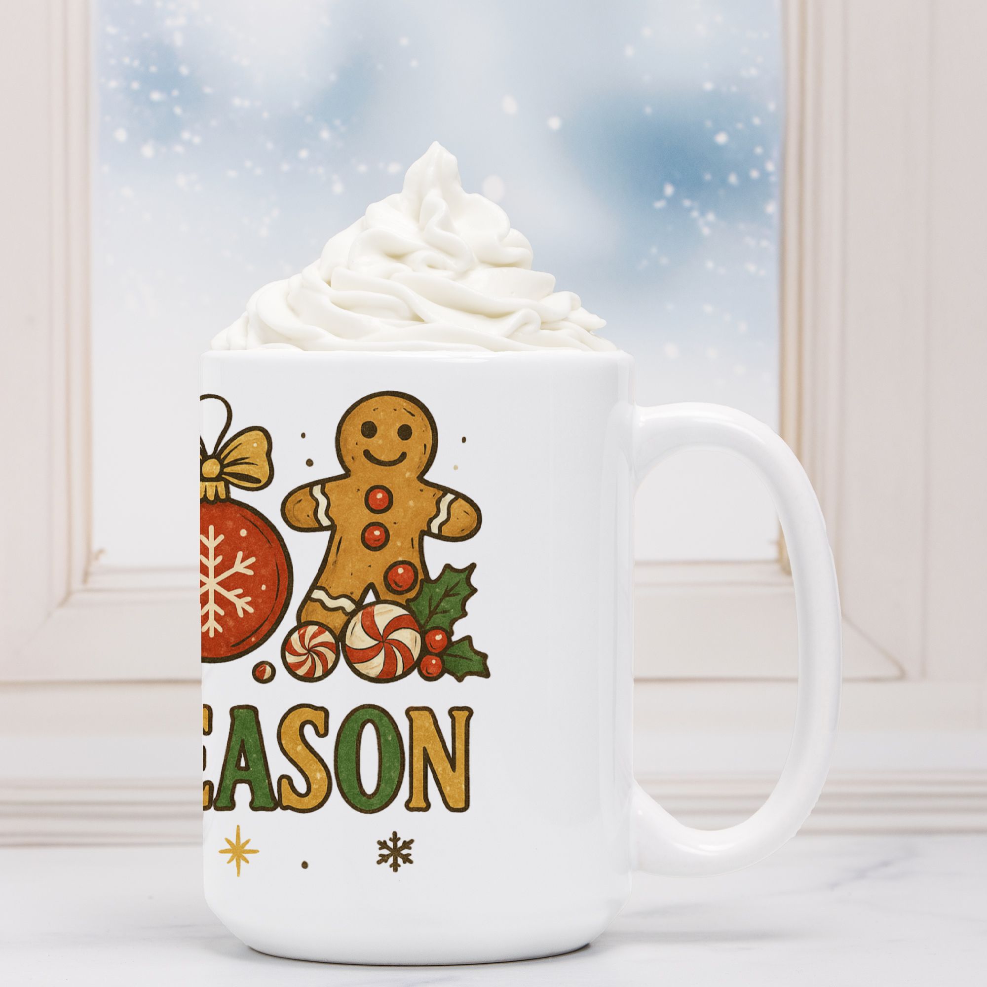 White mug with Christmas-themed design featuring a gingerbread man and candy, filled with hot chocolate and whipped cream.