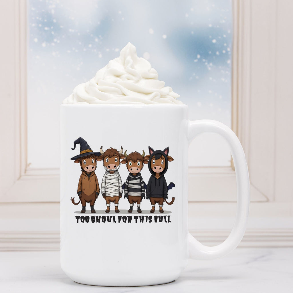 White mug with cartoon characters in costumes and text 'Too Ghoul for this Bull' against a snowy window background.