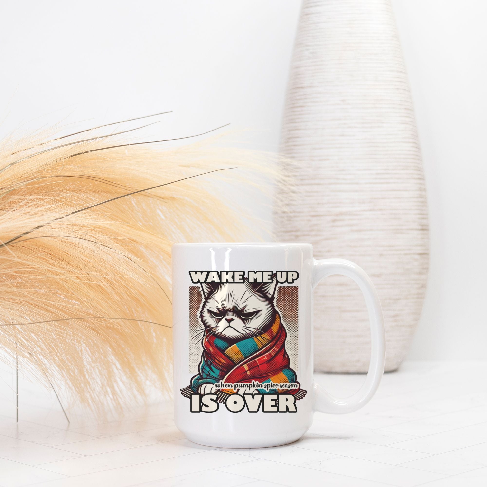 Mug with a cat graphic and text 'Wake me up when pumpkin pie is over' on a white background