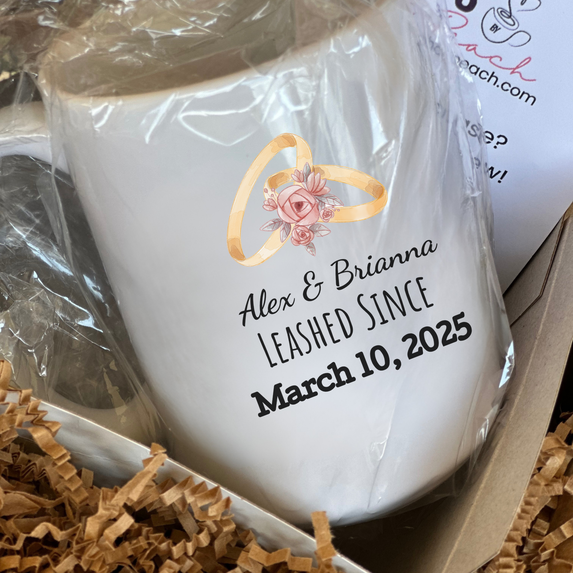 White mug with personalized text and ring design in a gift box
