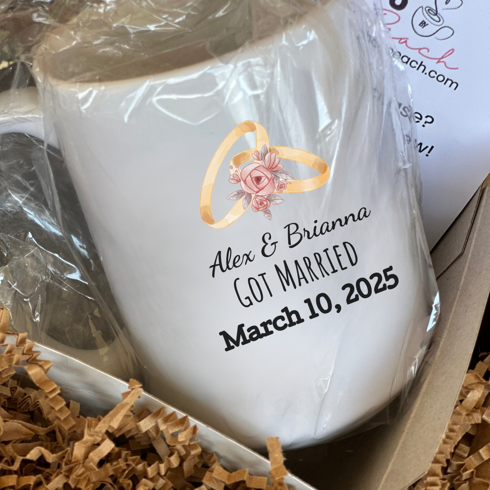 White mug with personalized text and ring design in a gift box