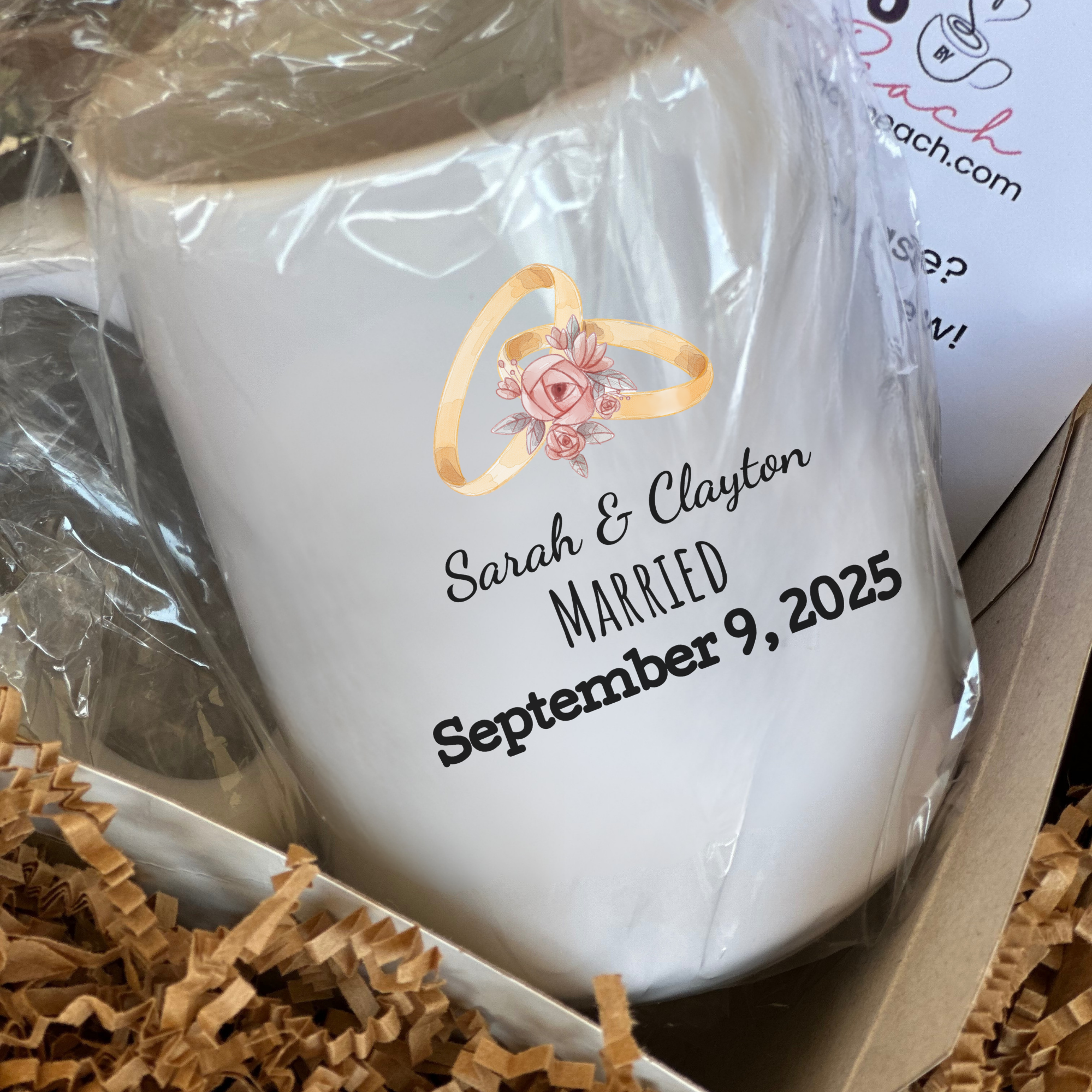 White mug with personalized text and ring design in a gift box