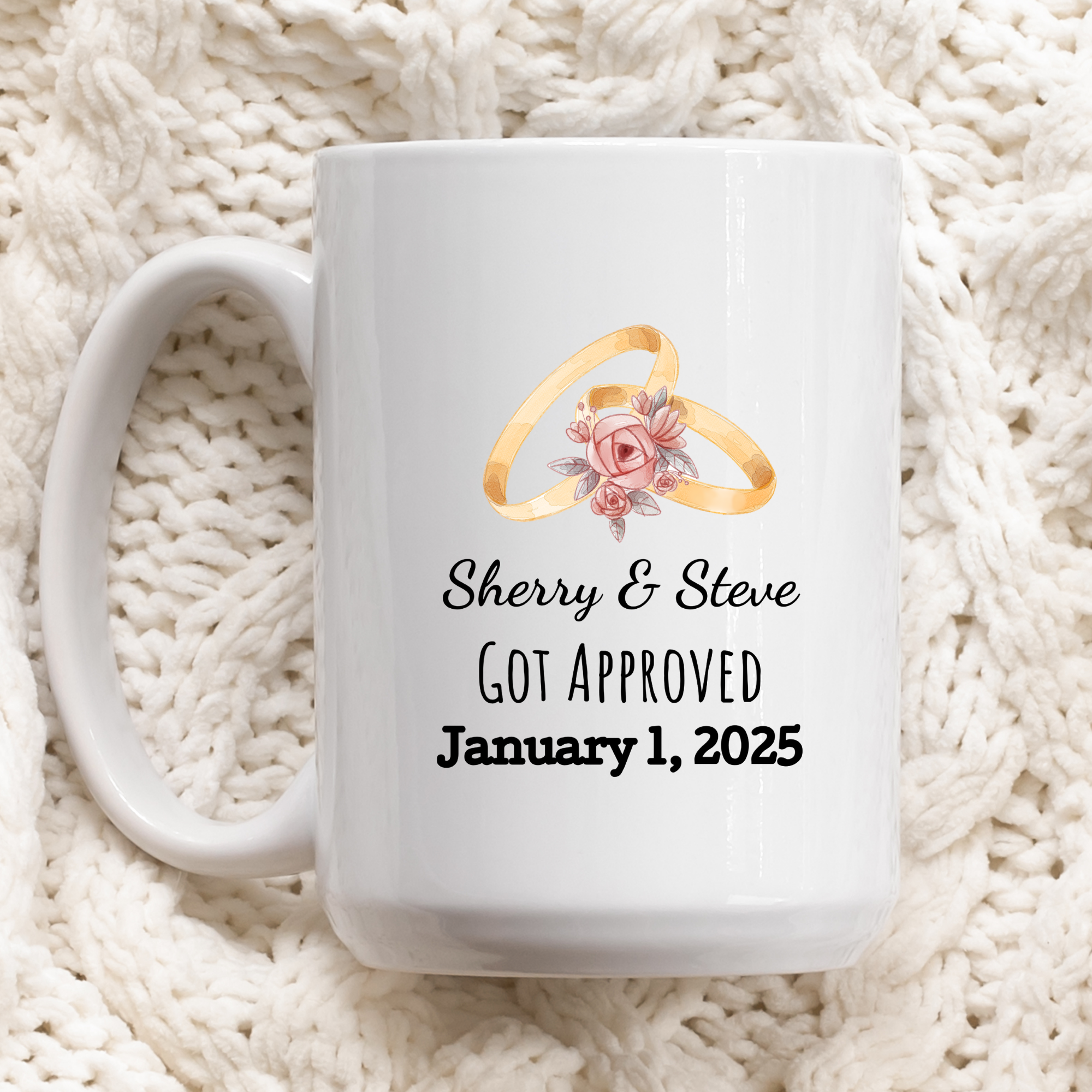 White mug with wedding rings and personalized text on a white textured background