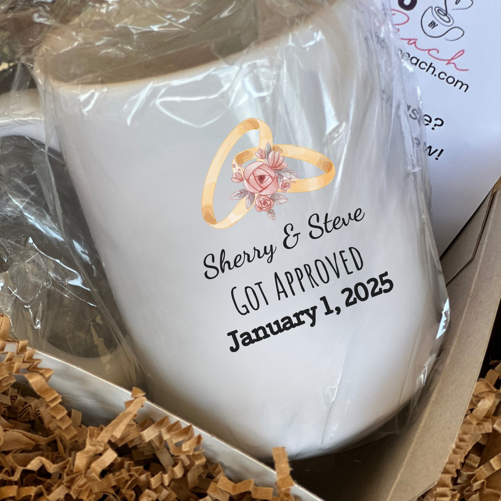 White mug with personalized text and ring design in a gift box