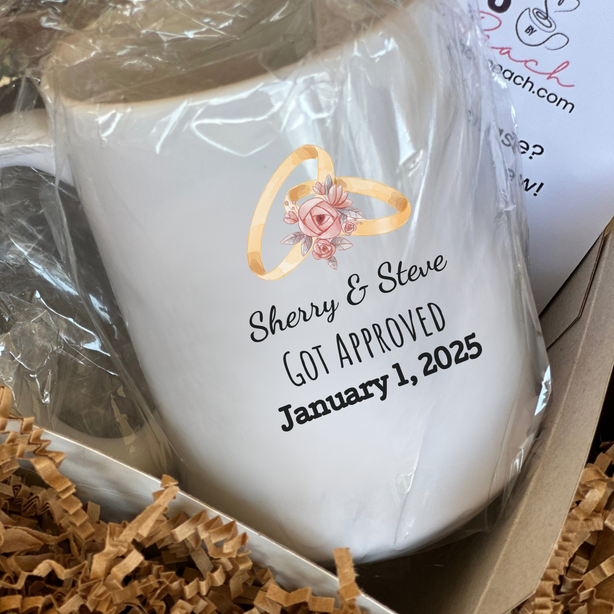 White mug with personalized text and ring design in a gift box