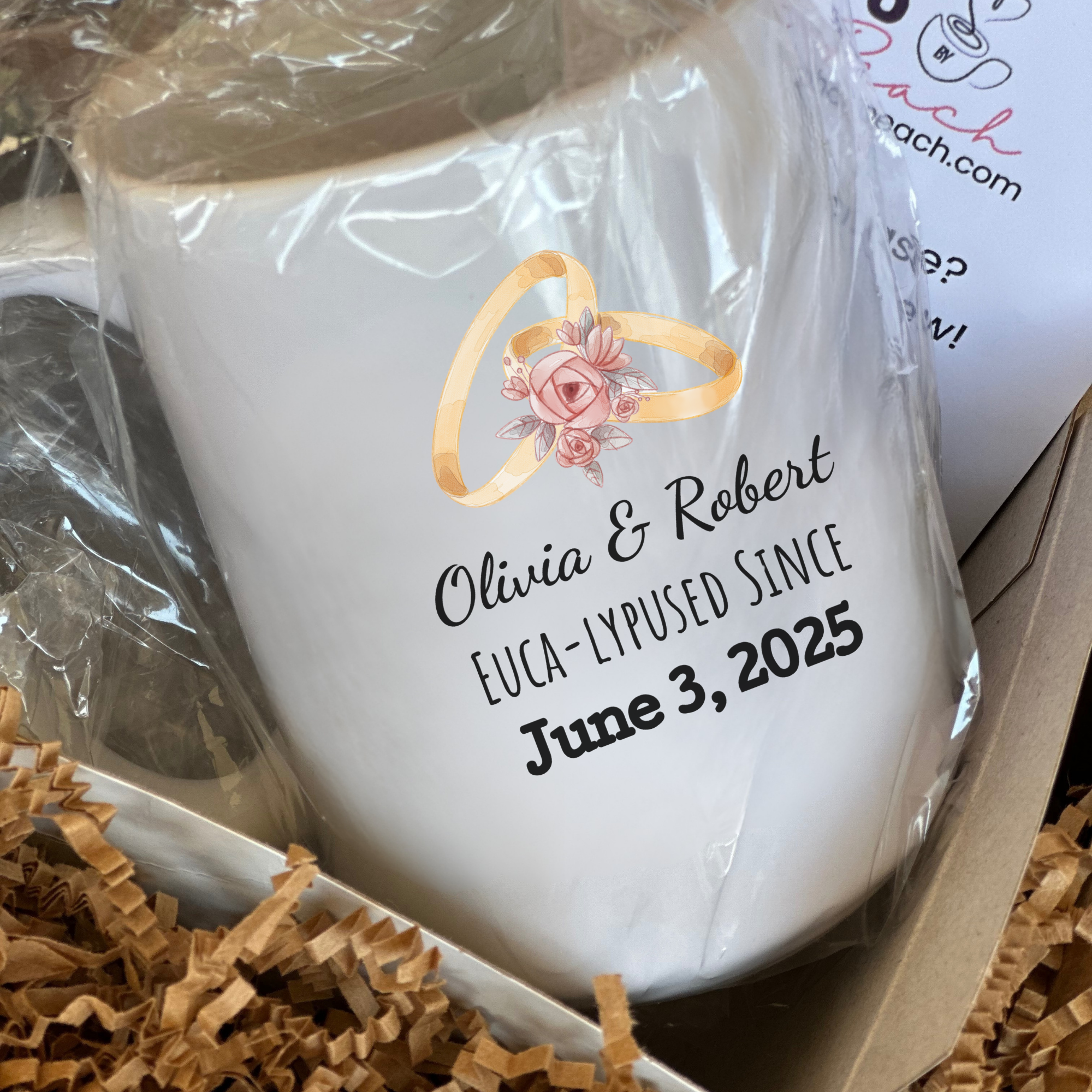 White mug with personalized text and ring design in a box