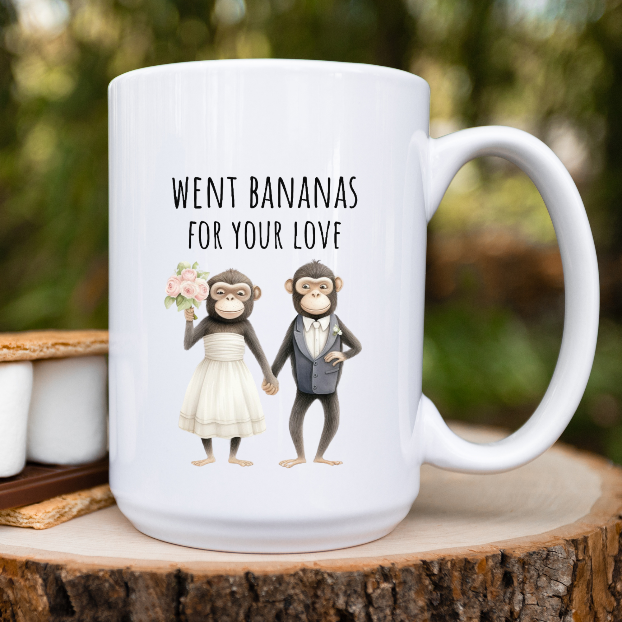 White mug with cartoon monkeys in wedding attire and text 'Went bananas for your love' on a wooden surface.