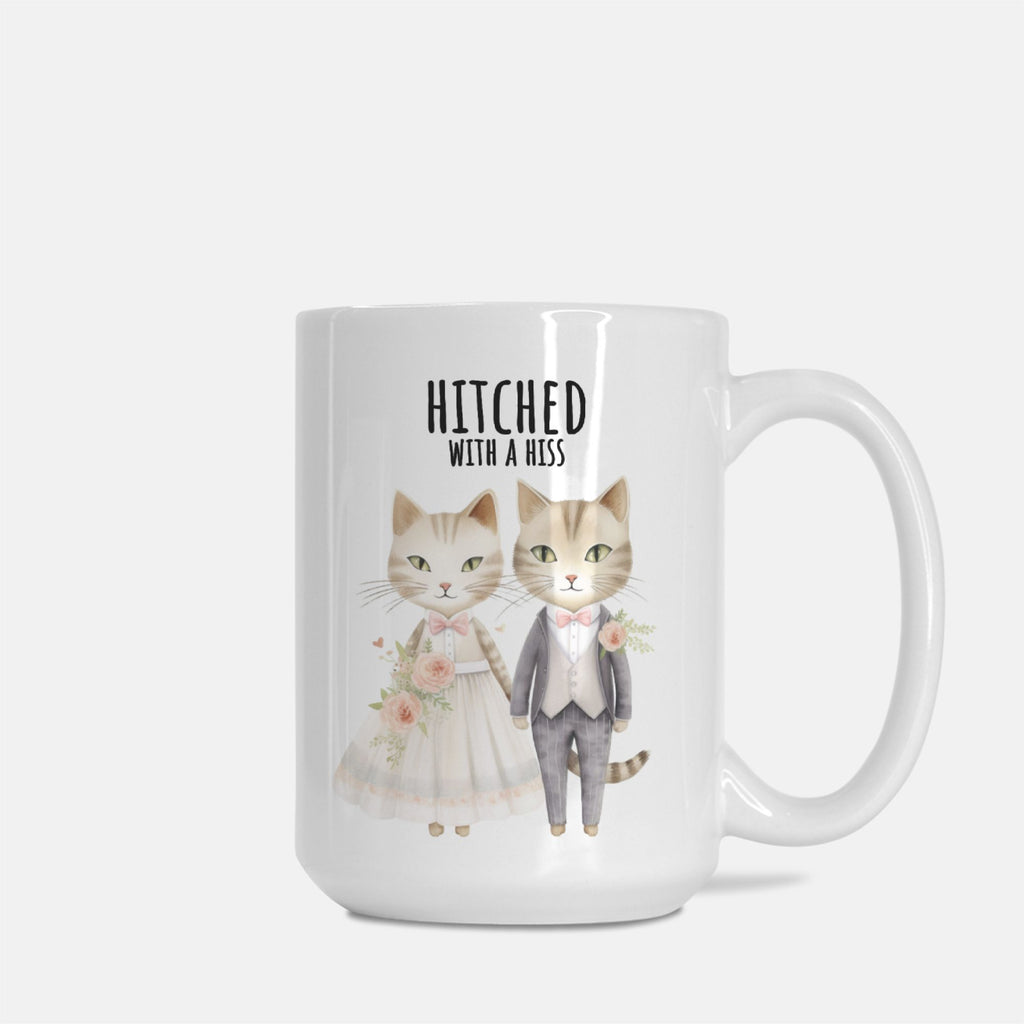 Mug with cartoon cats in wedding attire and 'Hitched with a Hiss' text on a white background