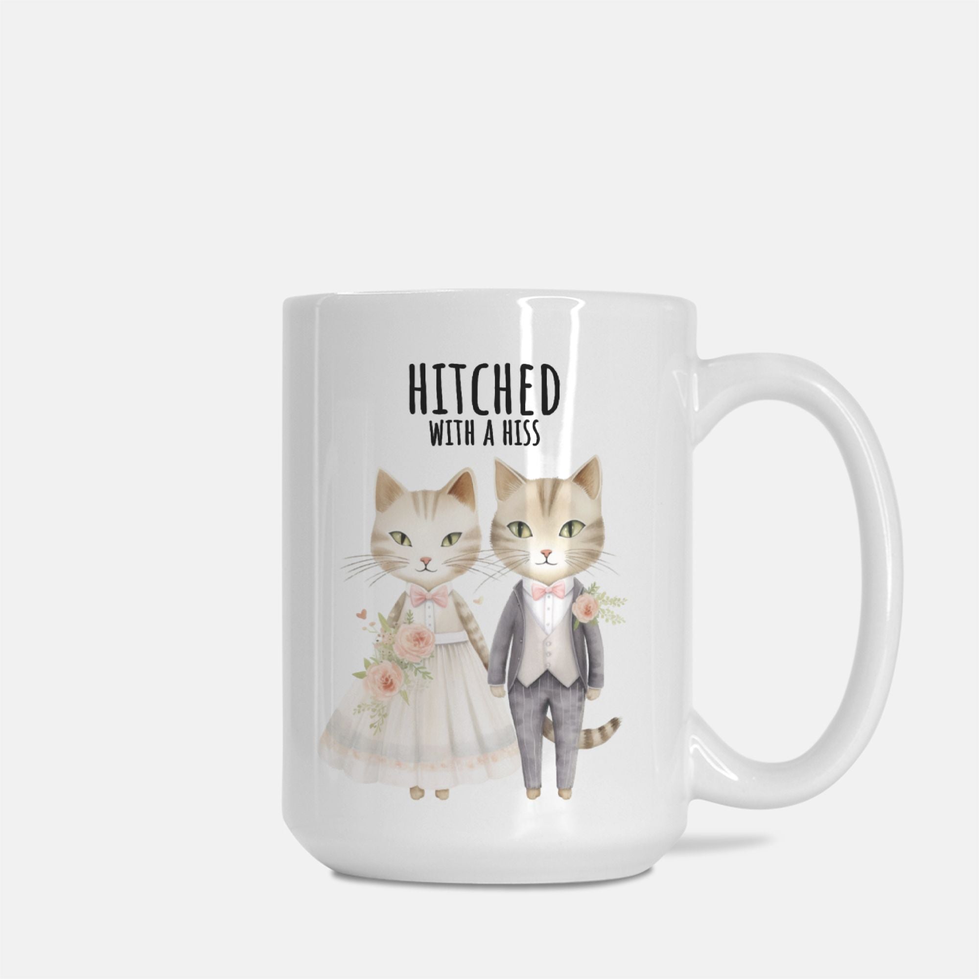 Mug with cartoon cats in wedding attire and 'Hitched with a Hiss' text on a white background