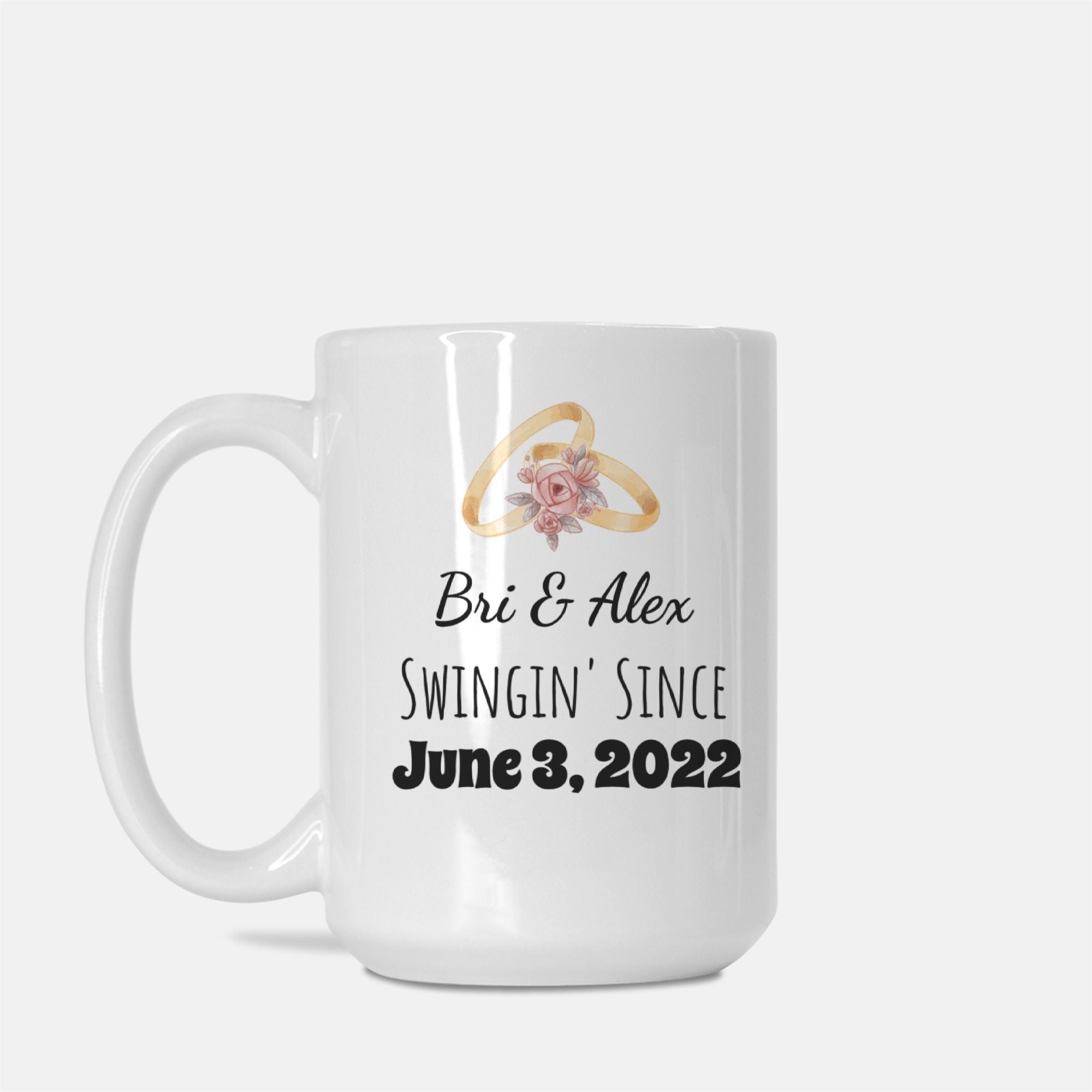 White mug with wedding rings and text 'Bri & Alex Swingin' Since June 3, 2022' on a white background