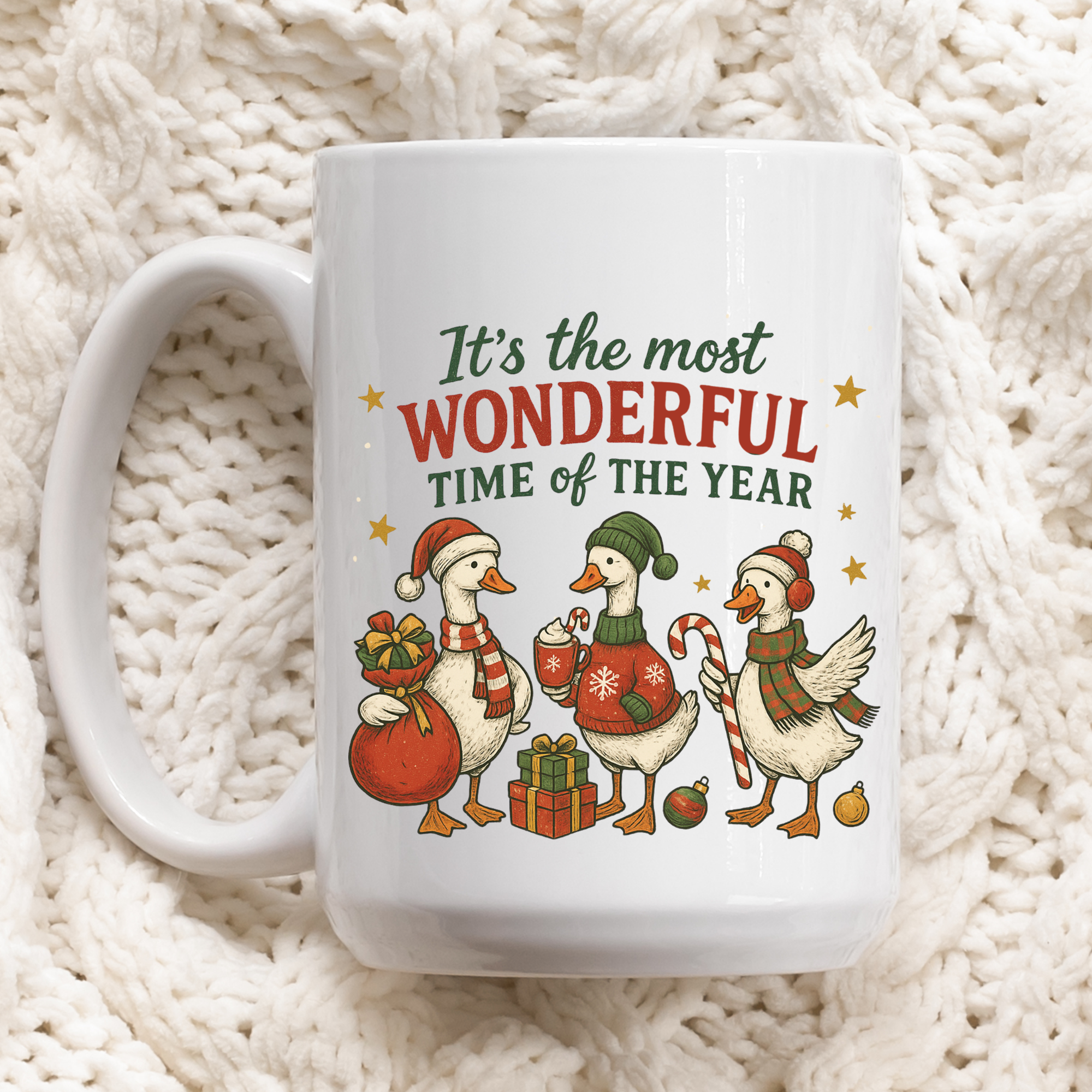 White mug with Christmas-themed design of ducks and text 'It's the most Wonderful time of the year' on a white textured background.